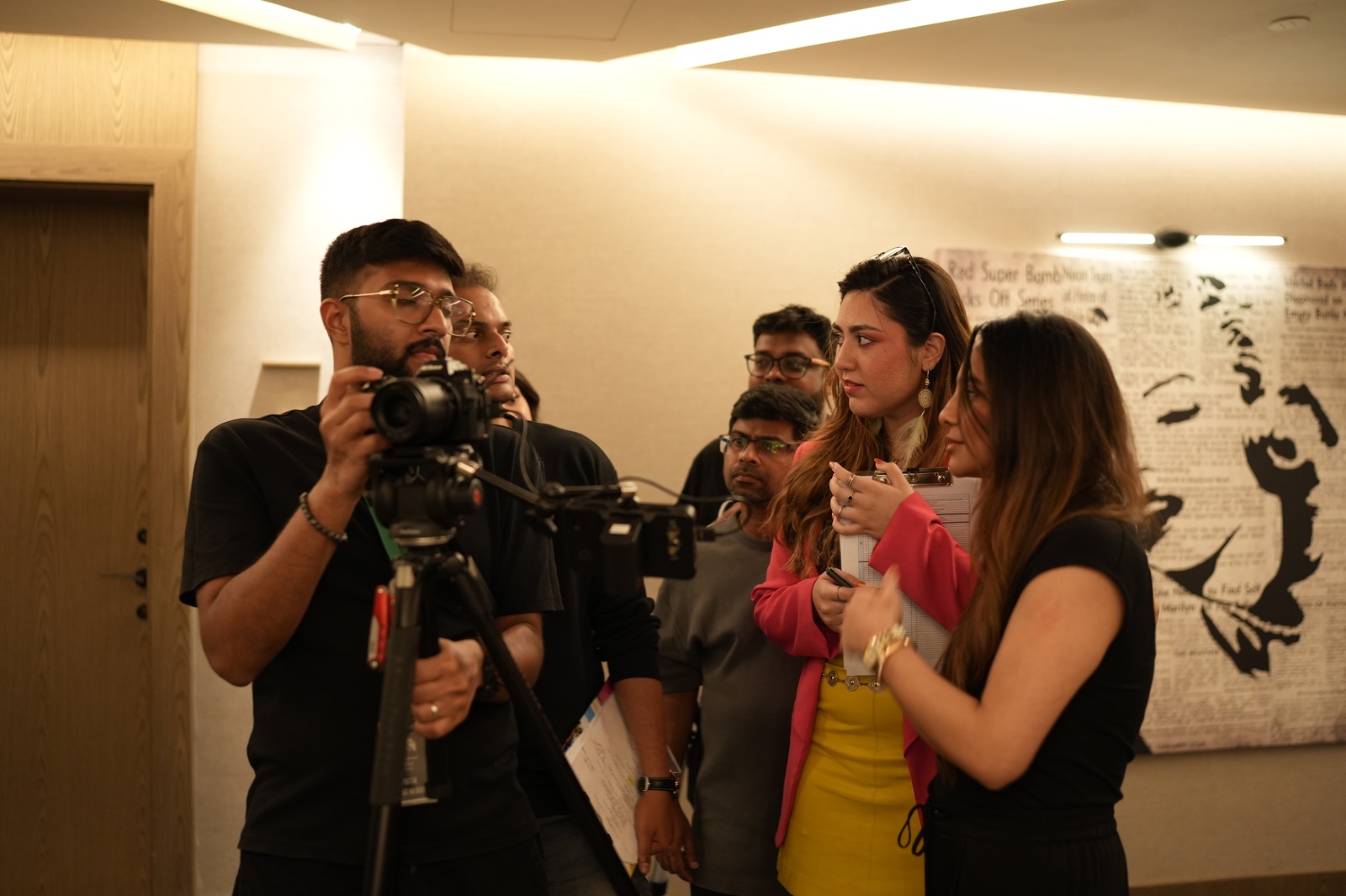 Director and actors in discussion